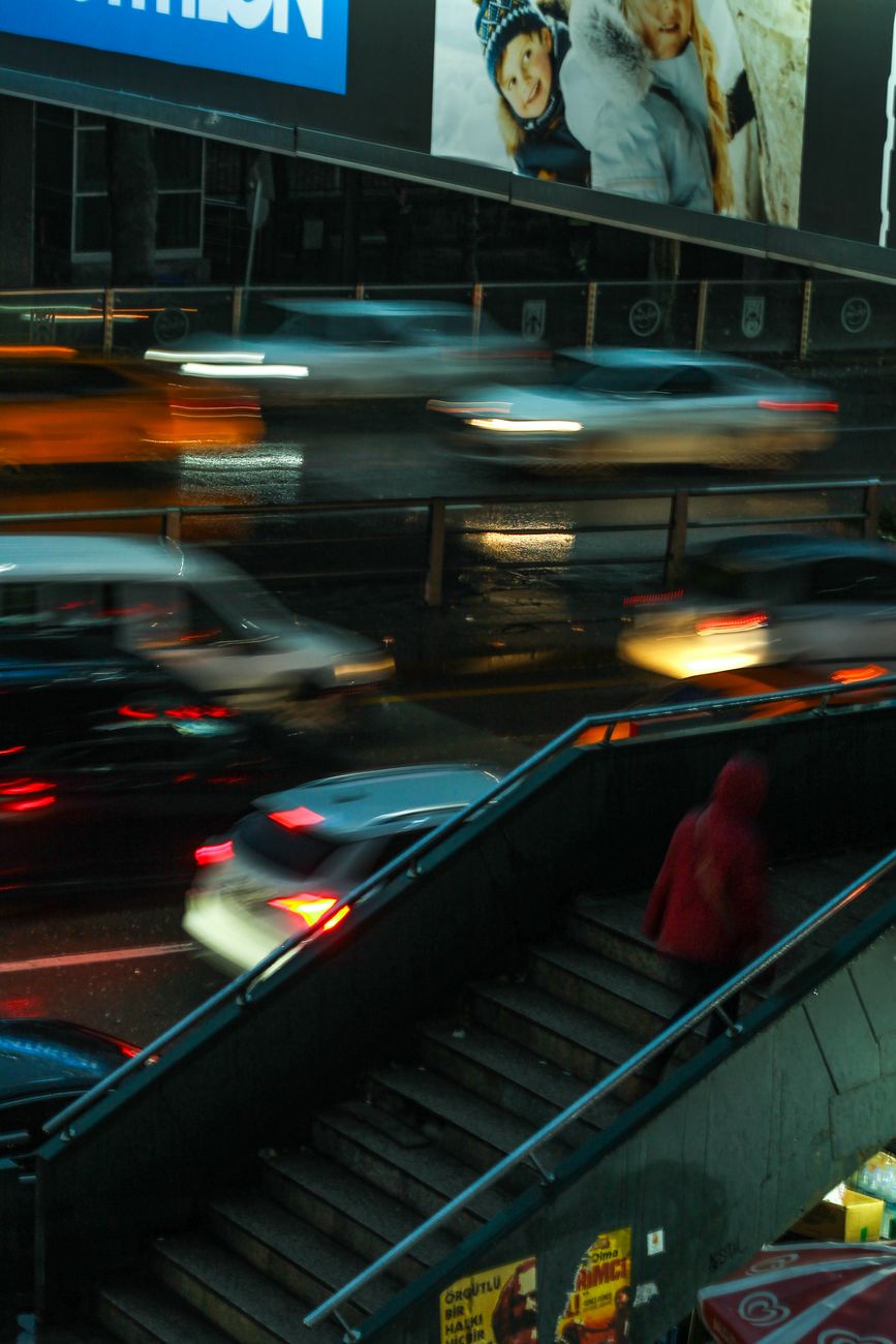 blurred motion of cars on the street in city